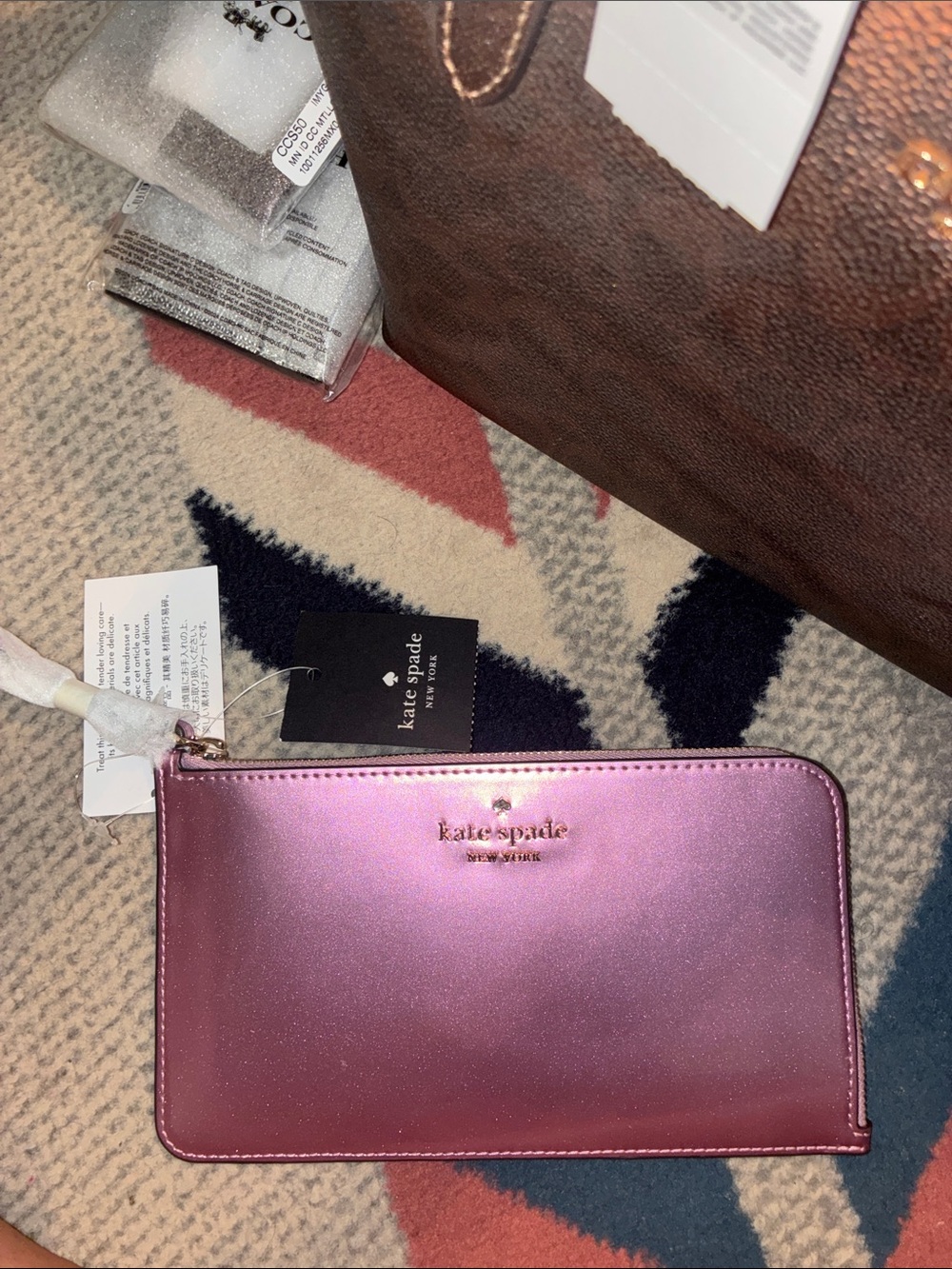 kate spade iridescent pink zip-around wristlet